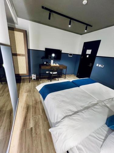 Ένα ή περισσότερα κρεβάτια σε δωμάτιο στο South32 Hotel