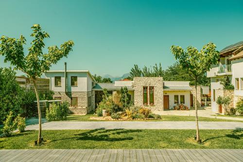 a home with a yard with trees and houses at Vintage Suites Trikala in Tríkala