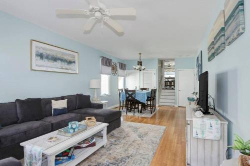 a living room with a couch and a tv at Seaside Serenity AC-Beautiful Ocean View Home -3 bed 2 bath in Atlantic City