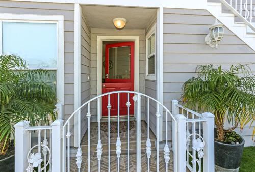 a red door on a house with a porch at 3 Bedrooms in Newport Beach