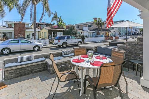 a table and chairs sitting on a patio at 3 Bedrooms in Newport Beach