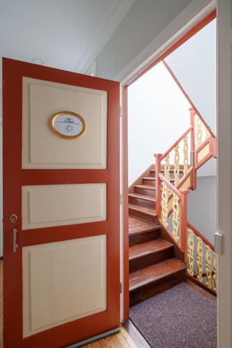 a door leading up to a staircase in a house at Apartamentos T1 de charme - Pombal, Centro Histórico in Pombal