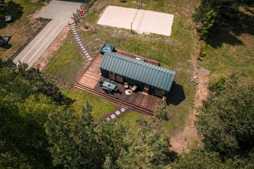 an aerial view of a train yard with a train car at Paežerės istorijos, Druskininkai in Veršiai
