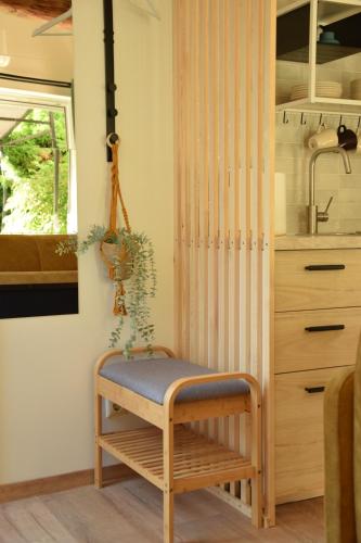 a bench with a plant on it in a kitchen at A&J apartments in Klaipėda