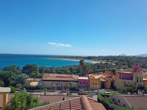 a view of a town and the ocean at Villa Laura in Villaputzu