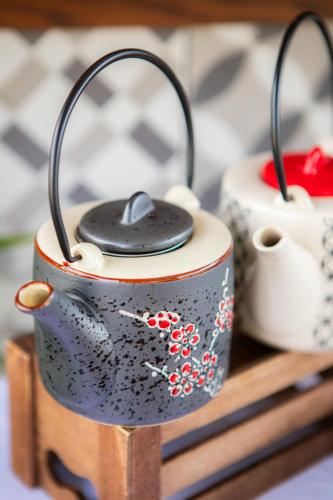 a model of a tea pot with a mouse on it at Vintage Suites Trikala in Tríkala