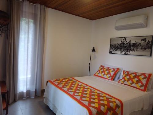 Postel nebo postele na pokoji v ubytování Pousada Casa Viva a Vida