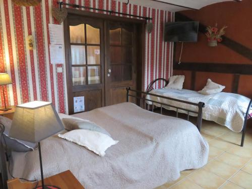 Postel nebo postele na pokoji v ubytování B&B Ferme du Petit Breuil