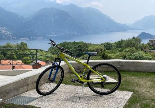 a yellow bike parked next to a wall at Casa Luca in Plesio