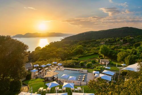an aerial view of a resort with a pool and the ocean at Golfo dei Poeti Relais & Spa in Ameglia