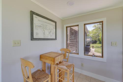 a room with a table and two chairs and a window at Water-View Beach House in Truro, Great for Groups! in Truro