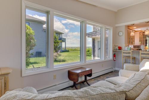 a living room with two couches and two windows at Water-View Beach House in Truro, Great for Groups! in Truro