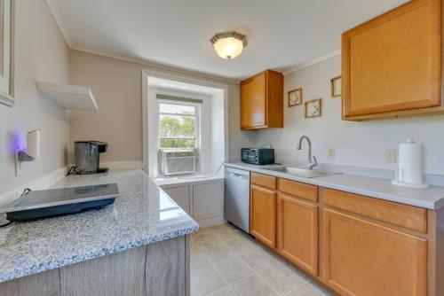 a kitchen with a sink and a counter top at Water-View Beach House in Truro, Great for Groups! in Truro