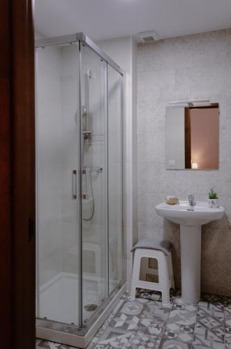 a bathroom with a shower and a sink at La posada de Alájar in Alájar
