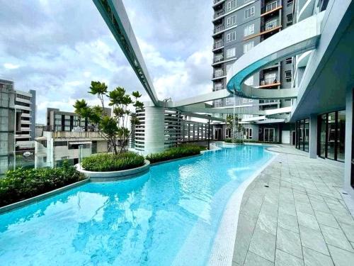 a large swimming pool in the middle of a building at DiamondHouse in Hat Yai