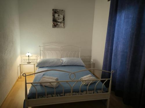 Posteľ alebo postele v izbe v ubytovaní Apartman Mihaela