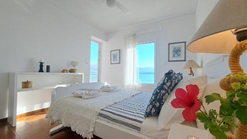 A bed or beds in a room at Alekos Beach Houses-Alekos Beach Complex