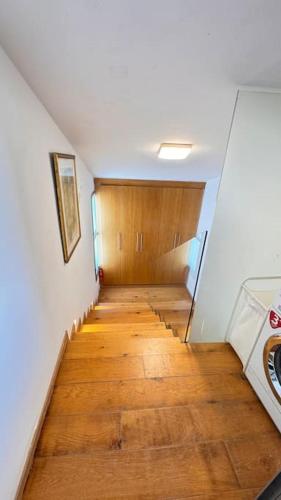 a long hallway with a wooden floor in a room at TEL AVIV -yafo in Tel Aviv