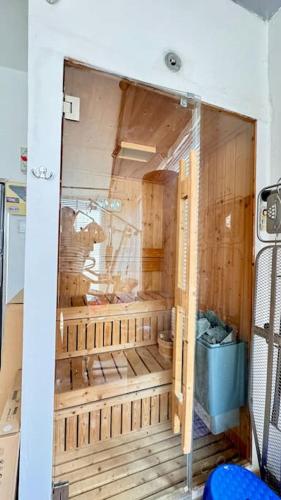 a room with a shower in a room with wooden walls at TEL AVIV -yafo in Tel Aviv