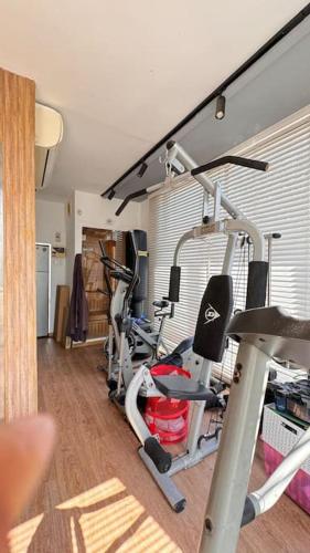 a gym with several exercise bikes in a room at TEL AVIV -yafo in Tel Aviv