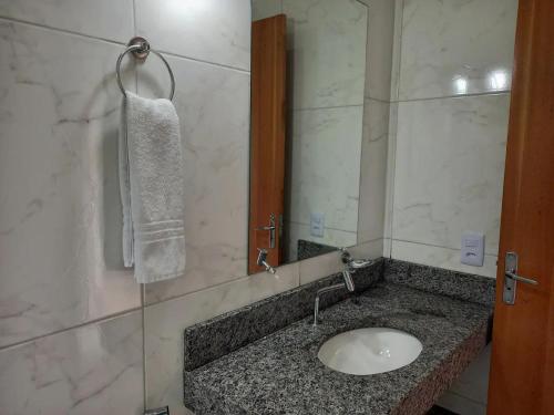 a bathroom with a sink and a mirror at Casa Sol in Prado