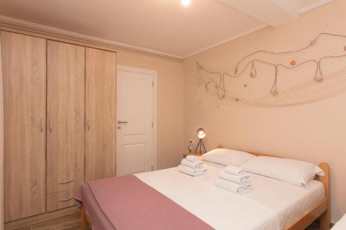 Postel nebo postele na pokoji v ubytování Apartment Olive Risan