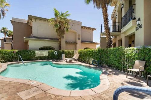 a swimming pool in front of a house at The Dylan - Chic 1BR in Old Town La Quinta in La Quinta