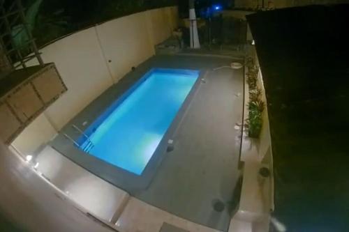 an overhead view of a swimming pool at night at Apartment Complex bijilo The gambia in Bijilo