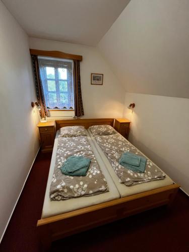 Postel nebo postele na pokoji v ubytování Apartments Dřevona II