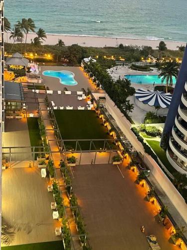 an aerial view of a resort with a pool and the ocean at Ocean front 2 Bedroom and 2 Bathroom apartment at The Alexander Resort in Miami Beach