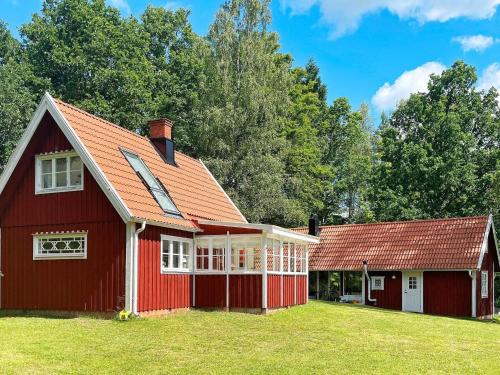 a red house with a red roof at 4 star holiday home in Osby in Osby