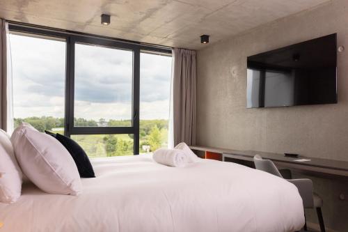 Katil atau katil-katil dalam bilik di Ki Space Hotel & Spa - near Disneyland Paris