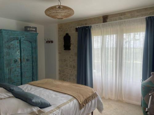Postel nebo postele na pokoji v ubytování Grange avec vue, proche de Sarlat, calme et dépaysement au coeur du Lot