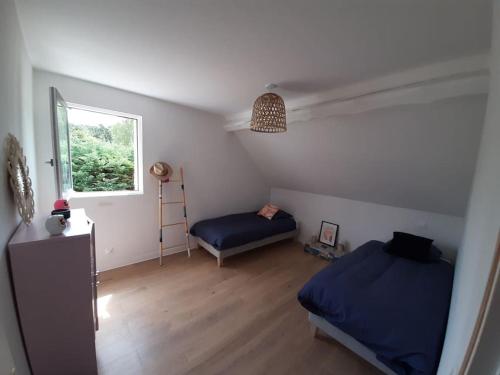 Ένα ή περισσότερα κρεβάτια σε δωμάτιο στο Le Colombier