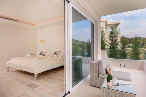 a bedroom with a bed and a sliding glass door at Villa Mila in Selca