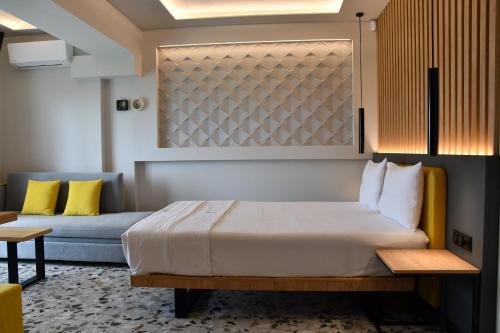 Ένα ή περισσότερα κρεβάτια σε δωμάτιο στο NERO SEASCAPE SUITES