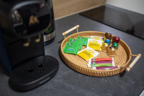 a wicker basket filled with electronics on a counter at Douceur d'argile in Toulouse