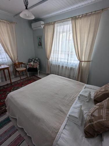Postel nebo postele na pokoji v ubytování Pensiunea Casa Veche