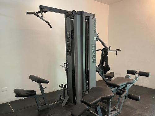 a gym with several exercise equipment in a room at Xeliter Balcones del Atlantico - Las Terrenas in Las Terrenas