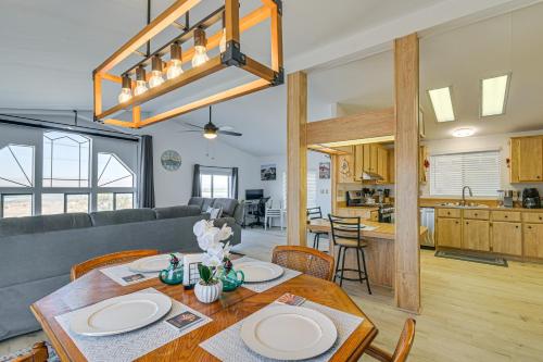 a dining room and living room with a table at 5 Mi to River Topock Boating and Off-Roading Oasis! in Topock