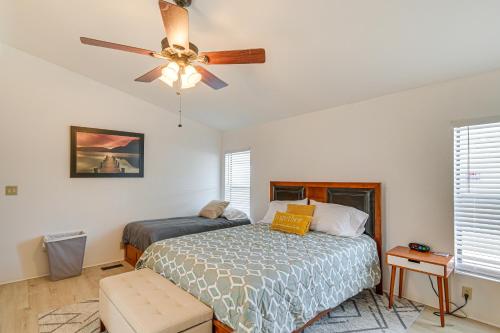 a bedroom with a bed and a ceiling fan at 5 Mi to River Topock Boating and Off-Roading Oasis! in Topock