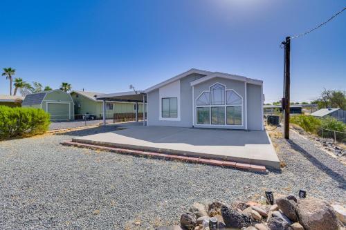 a house on a gravel driveway with a building at 5 Mi to River Topock Boating and Off-Roading Oasis! in Topock