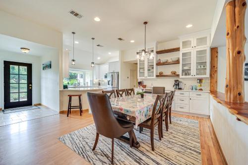 a kitchen and dining room with a table and chairs at Pin Oak Farmhouse with Patio in Dripping Springs in Dripping Springs