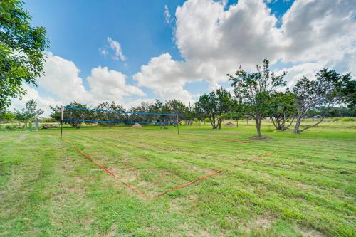 a large field with a soccer goal in the grass at Pin Oak Farmhouse with Patio in Dripping Springs in Dripping Springs