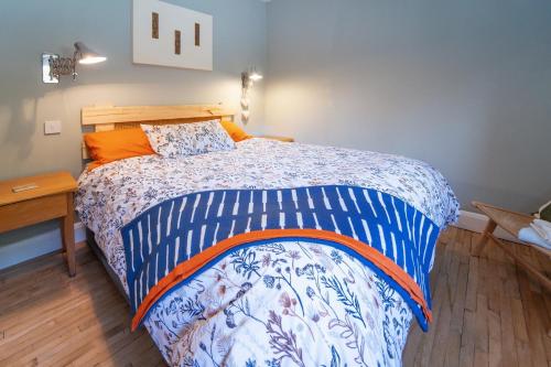 A bed or beds in a room at Cluain Abhainn 2-4 guests, private entrance