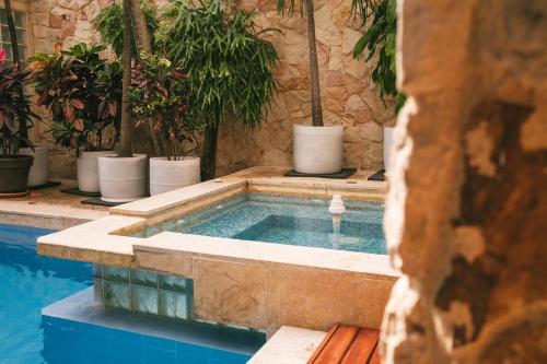 a swimming pool with a swimming pool at drb Suites in Cali
