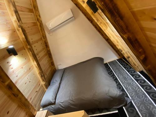 an overhead view of a bed in a tiny house at Ethno House Bektesevic in Gusinje