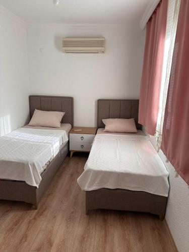 Ένα ή περισσότερα κρεβάτια σε δωμάτιο στο Bodrum merkez de müstakil ev