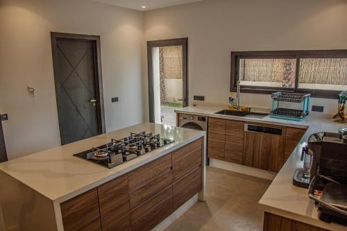 a kitchen with a stove and a counter top at AD Villa in Marrakesh
