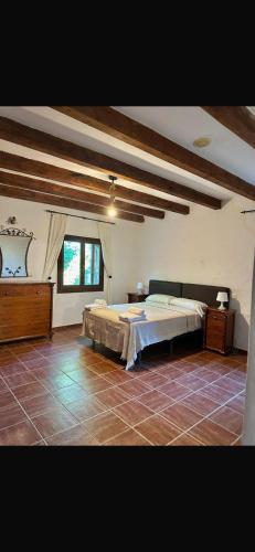 a bedroom with a large bed in a room at Villa Natalia in La Zarzuela